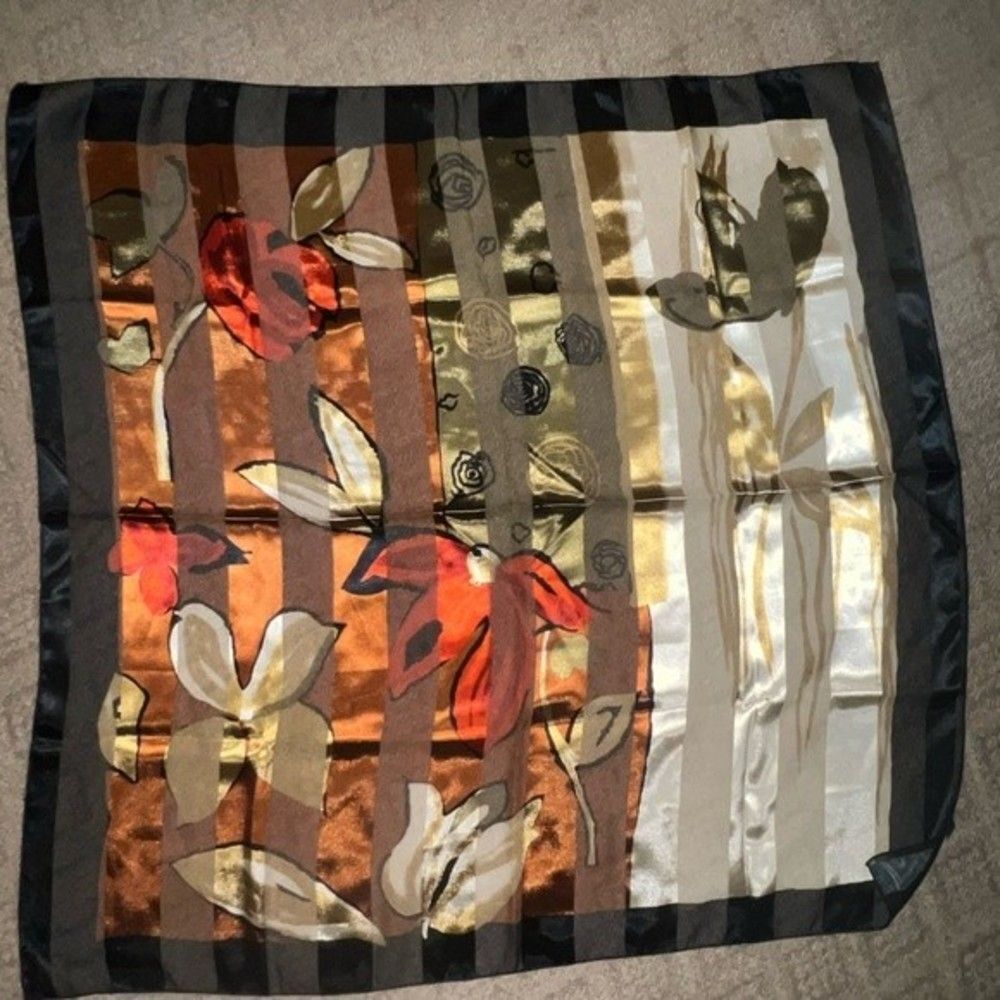 Square scarf with floral detail. 100% polyester